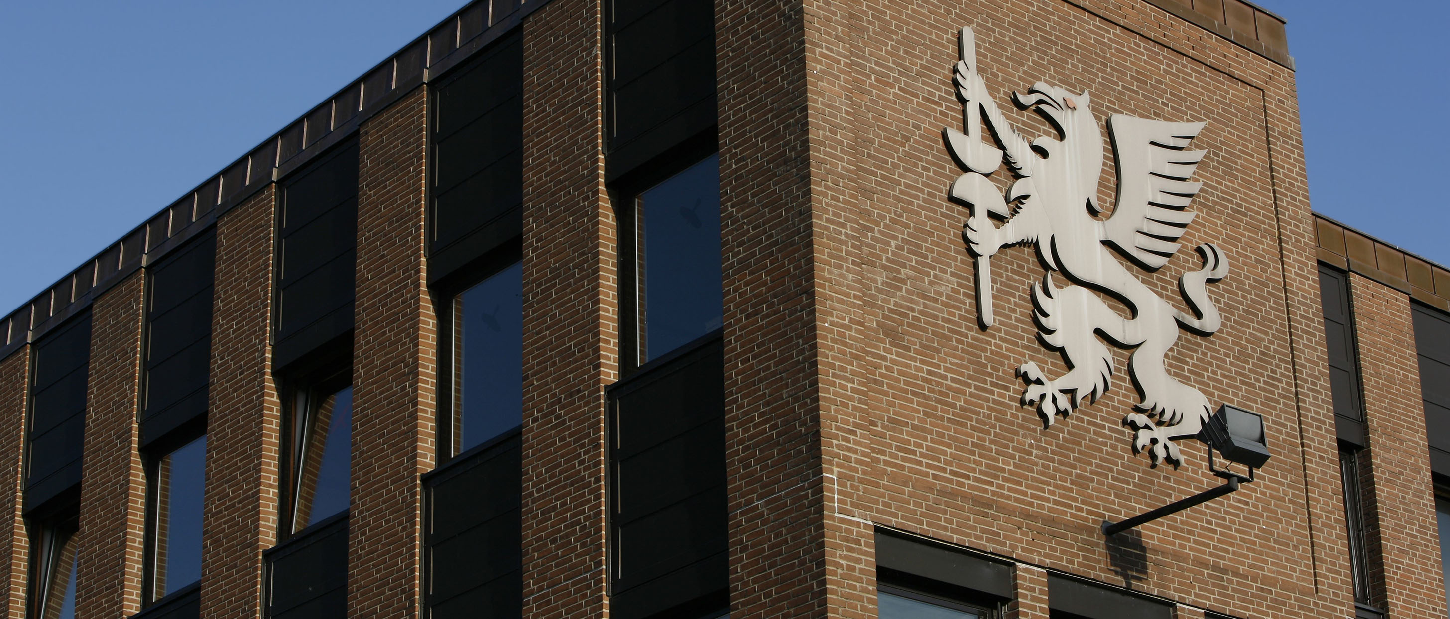 Neumann Group building with its griffin emblem